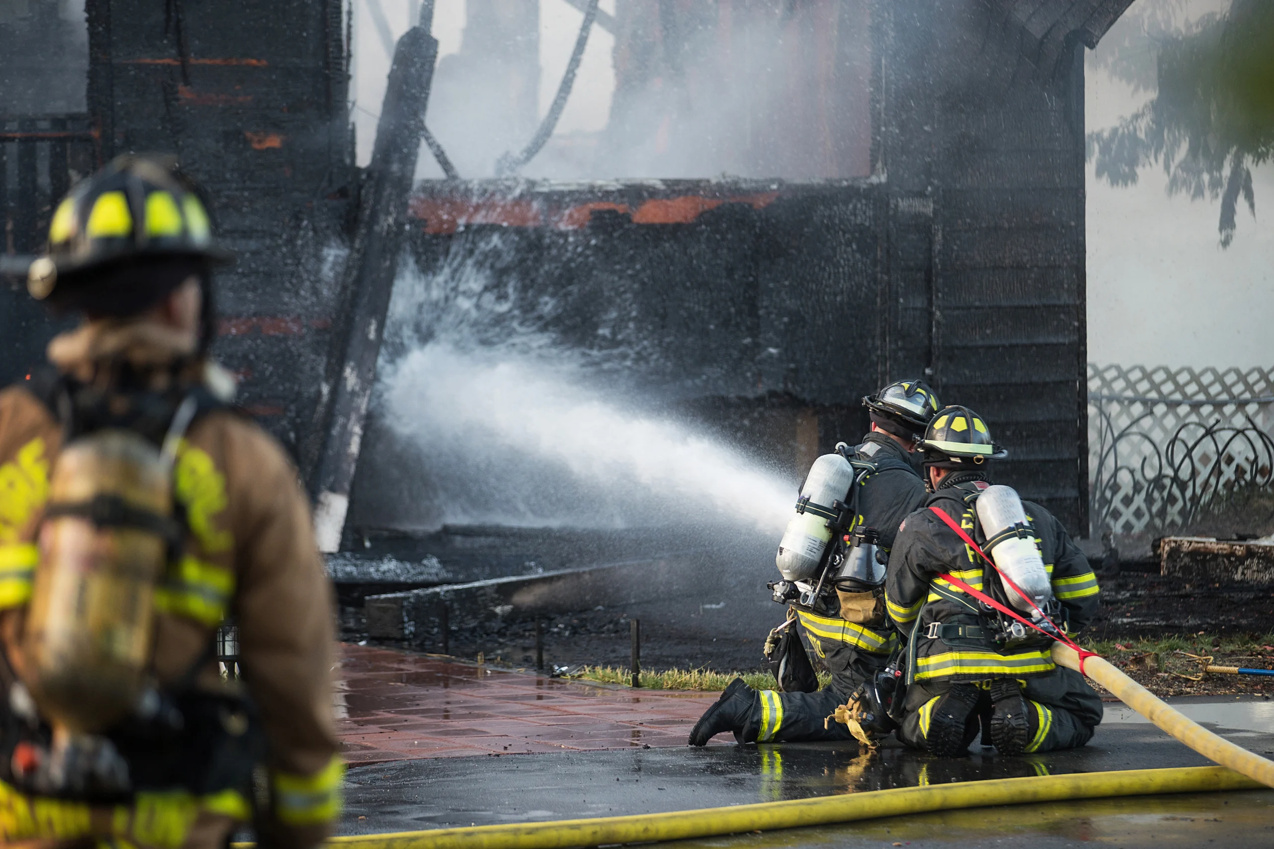 firefighter-sprays-water-on-burning-house-fire-2026-01-07-05-45-11-utc